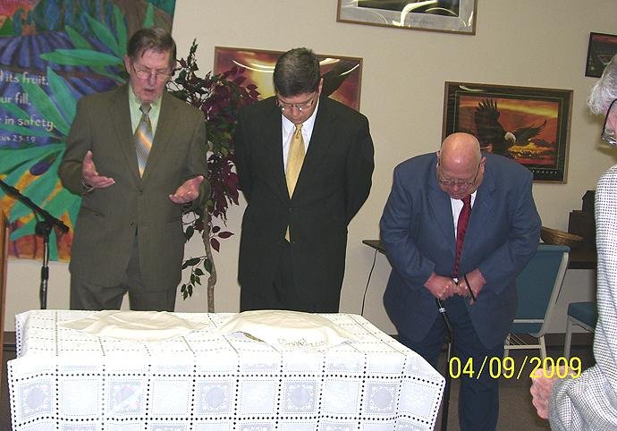 Praying over Passover Emblems.JPG